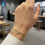 Midnight Clover Gold-Plated Herringbone Bracelet with white stone